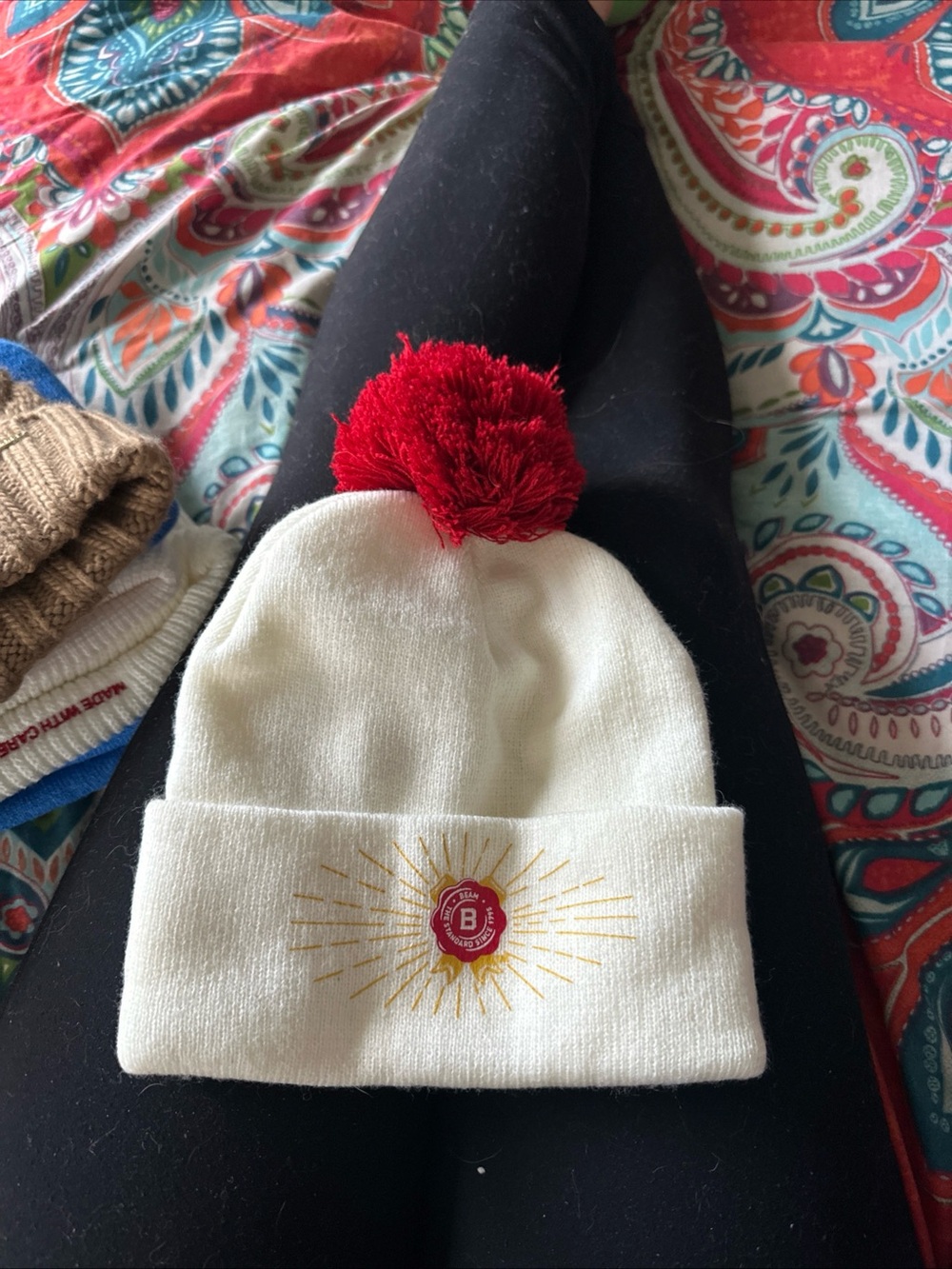 White Pom Pom Beanie with Red Emblem
